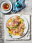 Kingfish with radish, watercress, Campari dressing and Bottarga