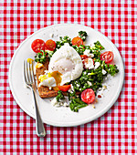 Kale, tomato and poached egg on toast