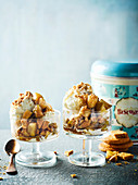 Winter ice cream sundaes with apples and biscuit crumbs