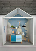 Creative idea for kitchen area with blue sink unit against artistic mural wallpaper