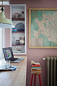 Shelves and old map on wall next to breakfast bar