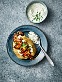 A baked potato filled with venison, mushrooms and herb quark
