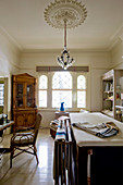 Antique corner cabinet and shelves in sewing room