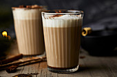 Chai latte in glasses with milk foam