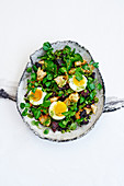 Black pudding and soft-boiled duck eggs with salsa verde