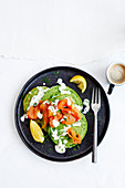 Green spinach pancakes with soured cream, smoked salmon and dill