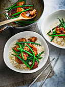 Pan-fried Szechuan chicken with green beans on rice (Asia)