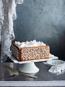 Fruit cake with gingerbread collar and baiser