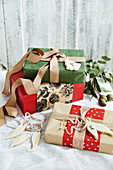 Christmas wrapped gifts with ribbons and tags