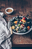 Kale salad with tomatoes, broad beans and mustard vinaigrette