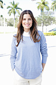 A young woman wearing a lilac jumper