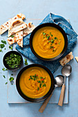 Vegan coconut and butternut squash soup with coriander and flatbreads