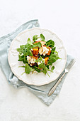 Overhead image of healthy salad with baked pumpkin and apples