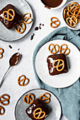 Peanut Brownies Topped With Dark Chocolate Ganache And Pretzels
