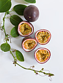 Purple passion fruits, whole and halved