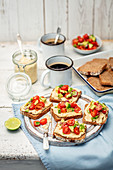 Toasts with hummus and avocado-tomato salsa