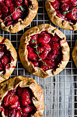 Sweet strawberry balsamic and thyme galettes wrapped up in a flakey buttery gluten-free crust