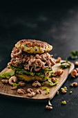 Shrimp burger with potato pancakes and lettuce leaves