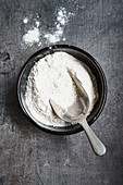 Flour in a bowl with a scoop