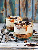 Cheesecake in a jar with chocolate, candy and caramel sauce