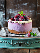 No Bake Cheescake with rapberries, frosting, mint and blackberries