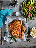 Ovenbaked chicken with green asparagus, bacon and thyme