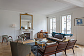 Mid-century modern furniture in living room of French period building