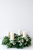 Advent wreath with white pillar candles