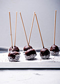 Vegan cakepops with rice milk chocolate and grated coconut