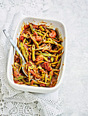 Runner beans with tomato and black onion seeds