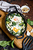 Green shakshuka with spinach and seasoning oil (keto cuisine)