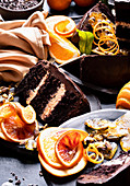Chocolate cake served with oranges and pistachio brittle