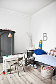 Bed, table and chair and Industrial-style wardrobe in teenager's bedroom