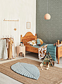 Classic wooden bed in the children's room in natural shades