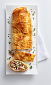 Fish strudel filled with porcini mushrooms, potatoes and bacon