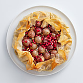 Pink grape cake with Roquefort and pomegranate seeds