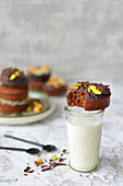 Baked muffins with chocolate and pistachios a glass of milk