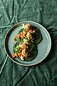 Spinach pancakes with a warm tomato salsa and falafel