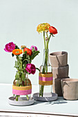 Glass bottles wrapped with woolen yarn used as vases