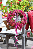 Purple wreath of rose hips, amaranth and ribbons