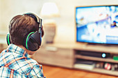 Young boy playing video game