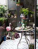 Metal storage cupboards on lavishly decorated balcony