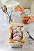 Homemade fluffy donuts with caramel sauce