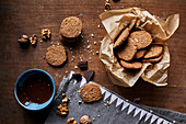 Walnut cookies and melted chocolate in a bowl