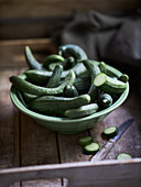 Small fresh snake cucumbers in a bowl
