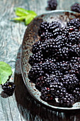 Fresh blackberries on a ceramic plate