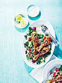 Sticky chicken drumsticks and sesame rice salad