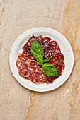 Pieces of dried meat with basil