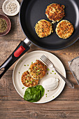 Tasty cutlets in pan and plate