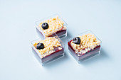 Glass containers with blueberry cakes